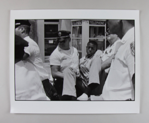 Image of Eddie Brown calmly being carried off by the Albany police, from "Civil Rights Series"