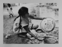 Image of Woman Cleaning Plates by River, Mexico